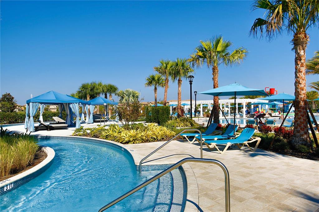 8809 Rhodes Street Kissimmee, FL 34747 - Photo 39 of 49 a view of a swimming pool with lounge chairs in patio