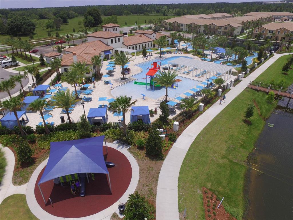 8809 Rhodes Street Kissimmee, FL 34747 - Photo 43 of 49 an aerial view of a swimming pool with a yard and lake view