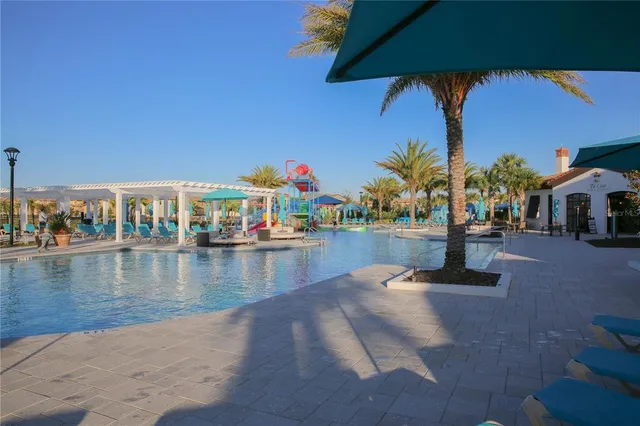 a view of swimming pool with outdoor seating