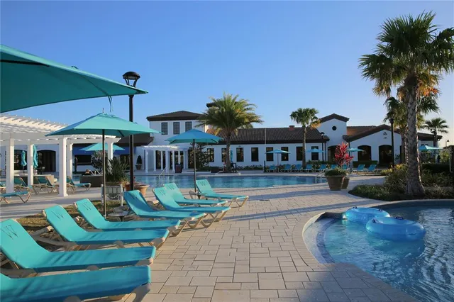 a view of patio with swimming pool and outdoor seating