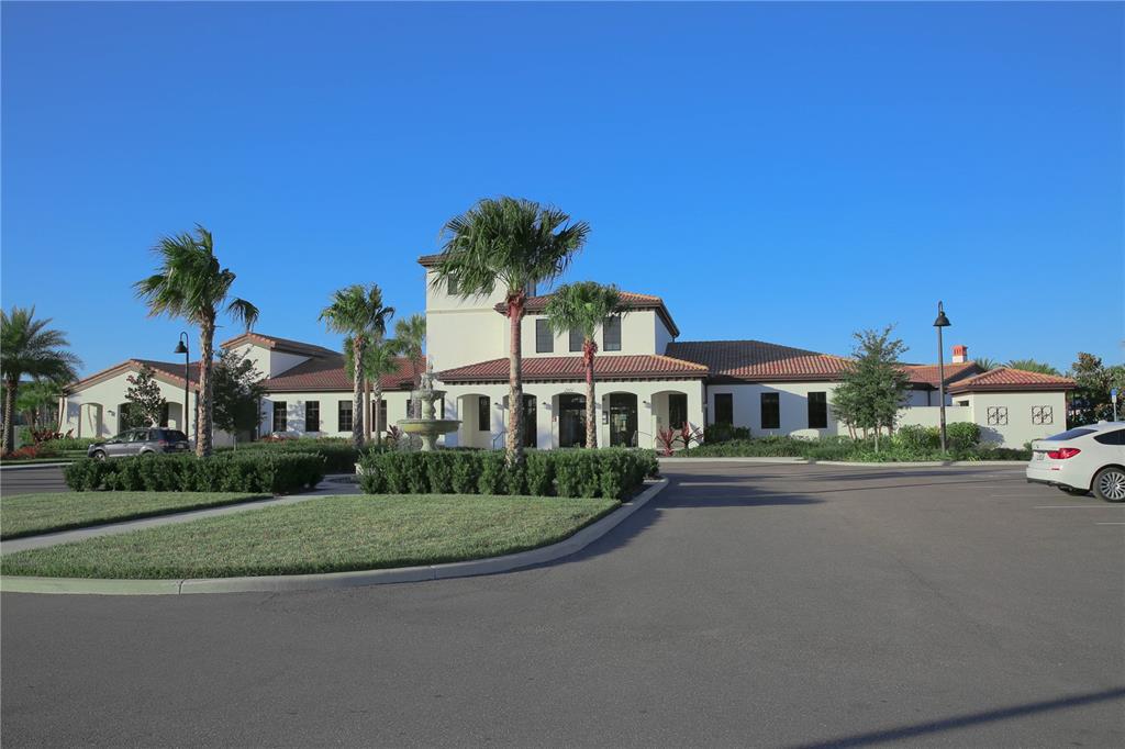 8809 Rhodes Street Kissimmee, FL 34747 - Photo 5 of 49 a front view of residential houses with yard and green space