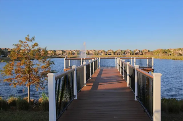 a view of a balcony with wooden floor and city view