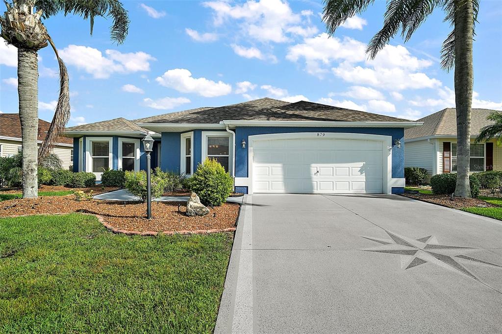 879 Chappells Drive The Villages, FL 32162 - Photo 1 of 1 front view of a house with a yard