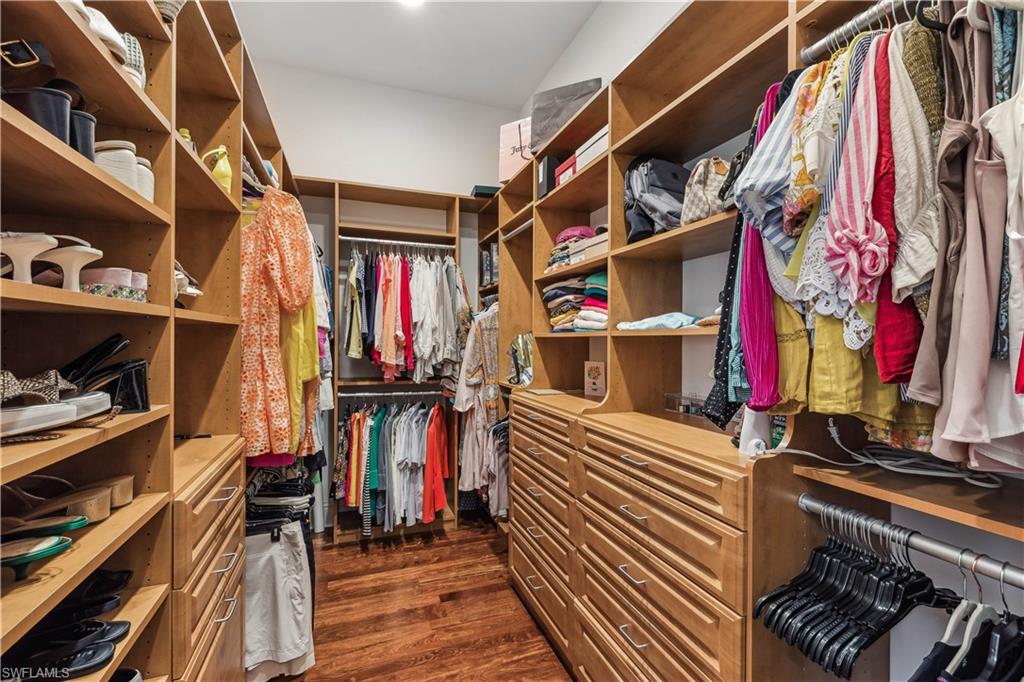 280 Egret Avenue Naples, FL 34108 - Photo 26 of 44 Walk-in California closet with dark wood-type flooring