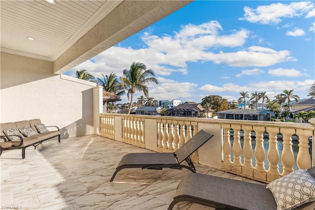 280 Egret Avenue Naples, FL 34108 - Photo 28 of 44 Nice-sized balcony from the primary room