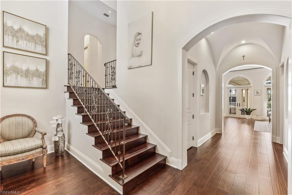 280 Egret Avenue Naples, FL 34108 - Photo 9 of 44 The entrance foyer on the first floor with dark wood-type flooring