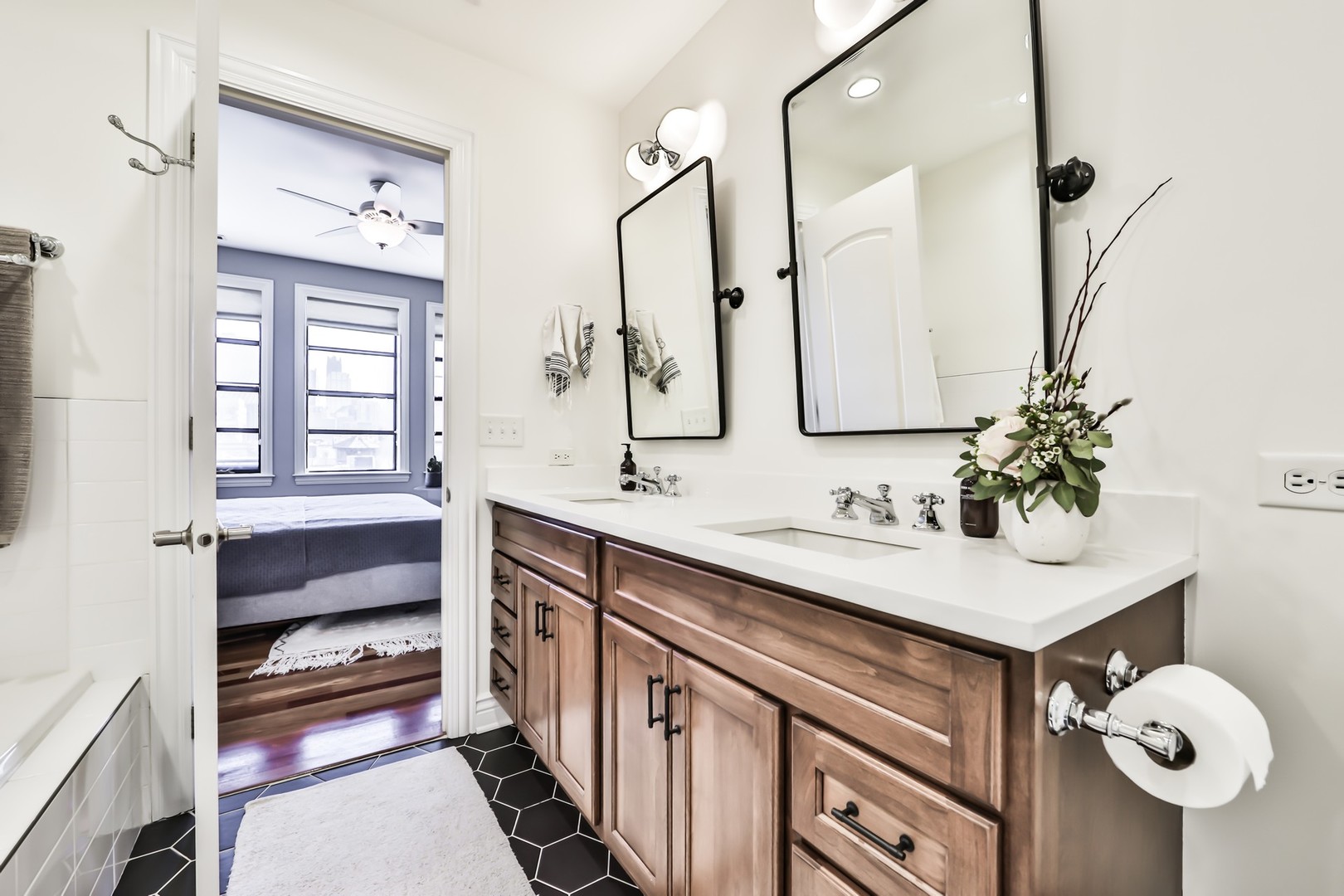 1148 West Monroe Street, Unit 5SE Chicago, IL 60607 - Photo 12 of 25 a bathroom with a sink and a mirror