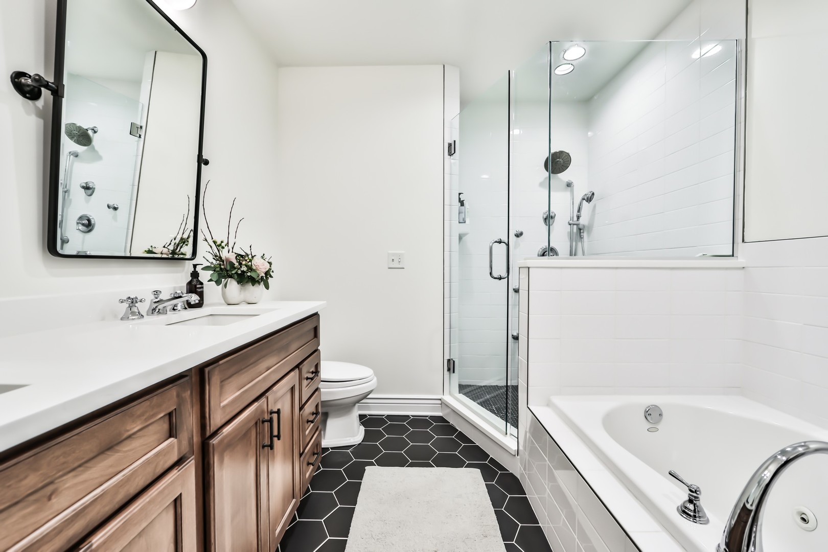 1148 West Monroe Street, Unit 5SE Chicago, IL 60607 - Photo 13 of 25 a bathroom with a tub sink and mirror