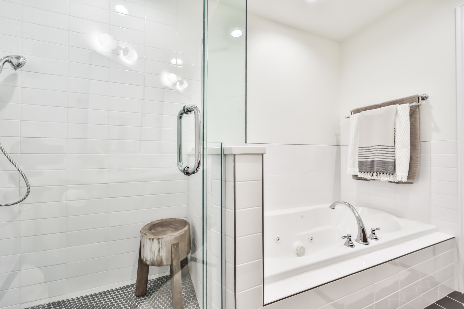 1148 West Monroe Street, Unit 5SE Chicago, IL 60607 - Photo 14 of 25 a bathroom with a tub a sink and a shower