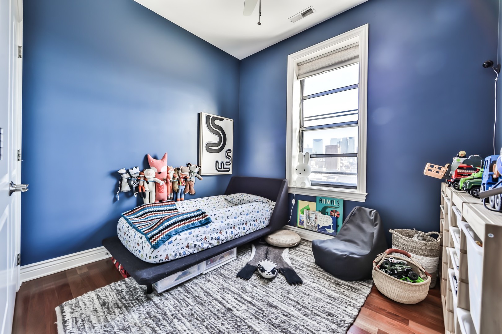 1148 West Monroe Street, Unit 5SE Chicago, IL 60607 - Photo 15 of 25 a living room with furniture and a window