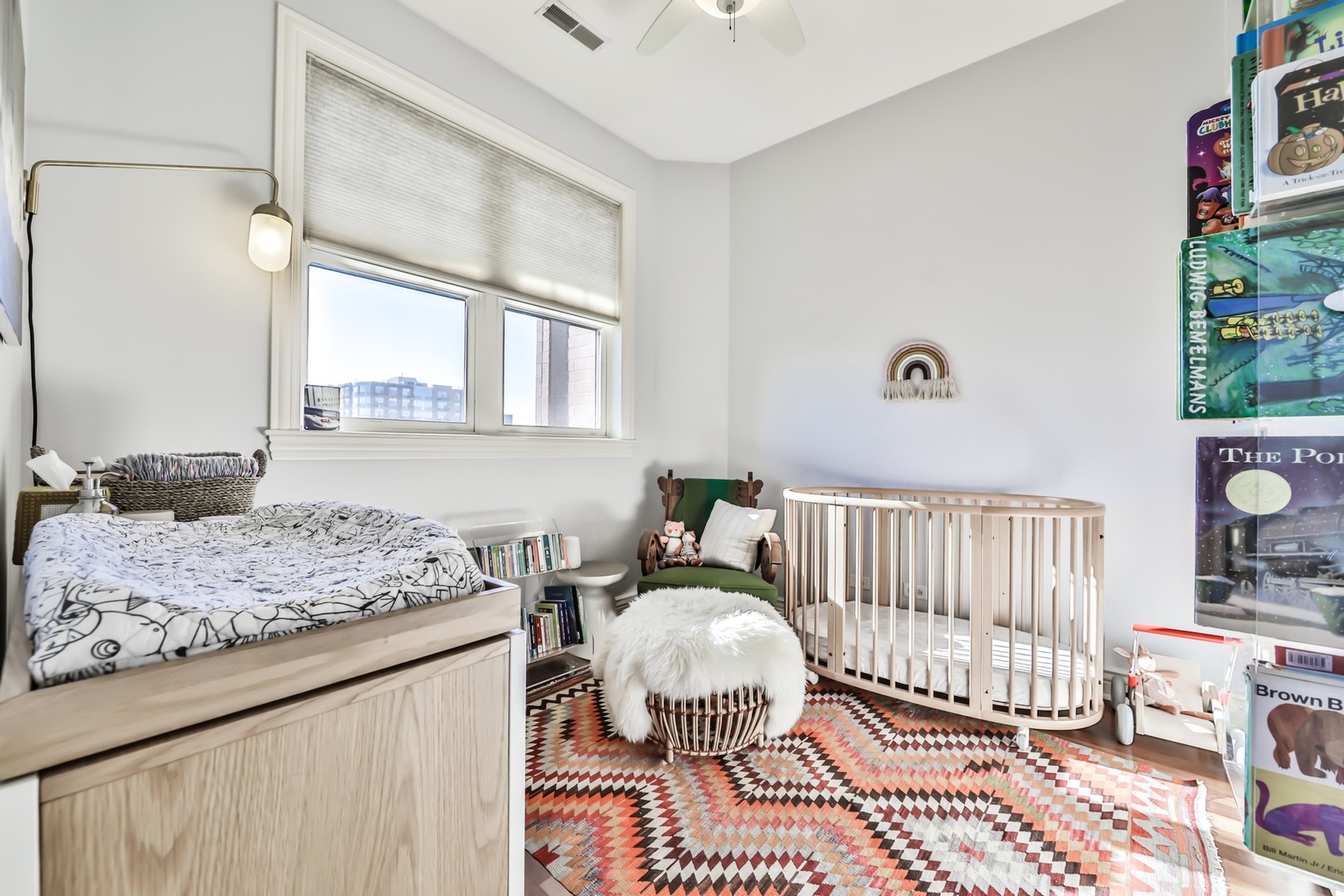 1148 West Monroe Street, Unit 5SE Chicago, IL 60607 - Photo 16 of 25 a bedroom with a bed and wooden floor