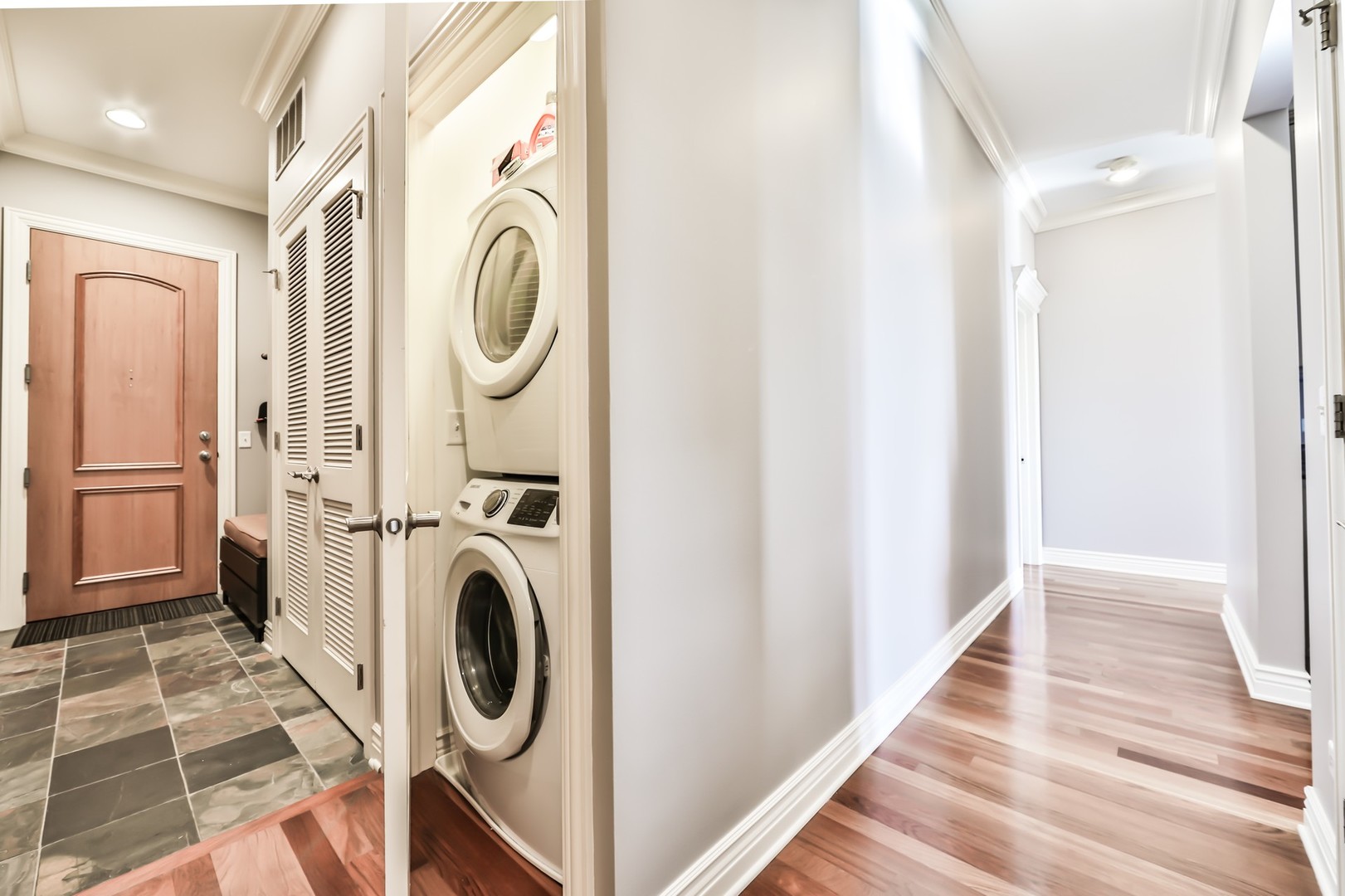1148 West Monroe Street, Unit 5SE Chicago, IL 60607 - Photo 19 of 25 a view of a hallway with washer and dryer