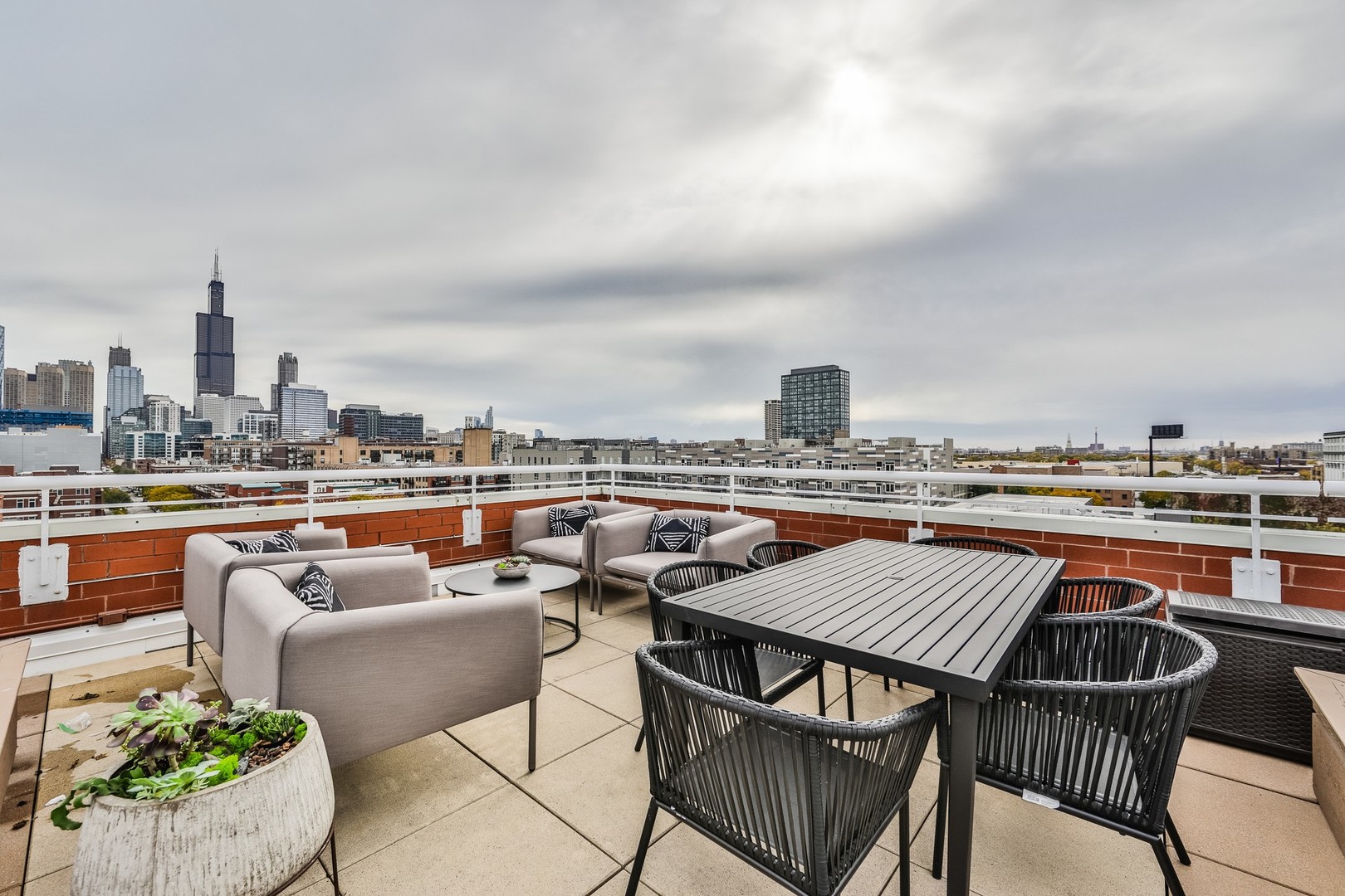 1148 West Monroe Street, Unit 5SE Chicago, IL 60607 - Photo 22 of 25 a view of roof deck with seating space and barbeque oven