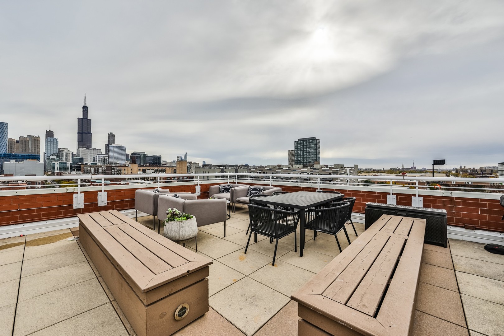 1148 West Monroe Street, Unit 5SE Chicago, IL 60607 - Photo 23 of 25 a terrace with a table and chairs