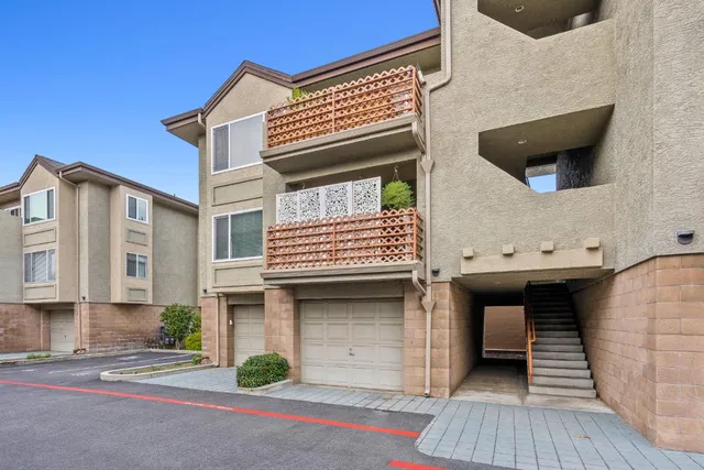 a front view of a house with garage