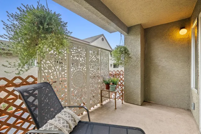 a view of a sign board with wooden fence