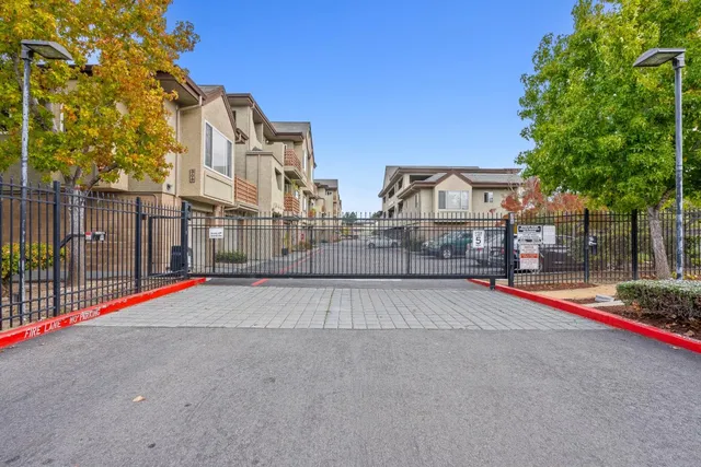 a view of a chairs and table in a backyard