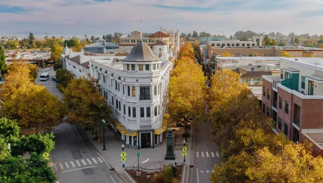 a view of swimming pool with outdoor seating and lake view