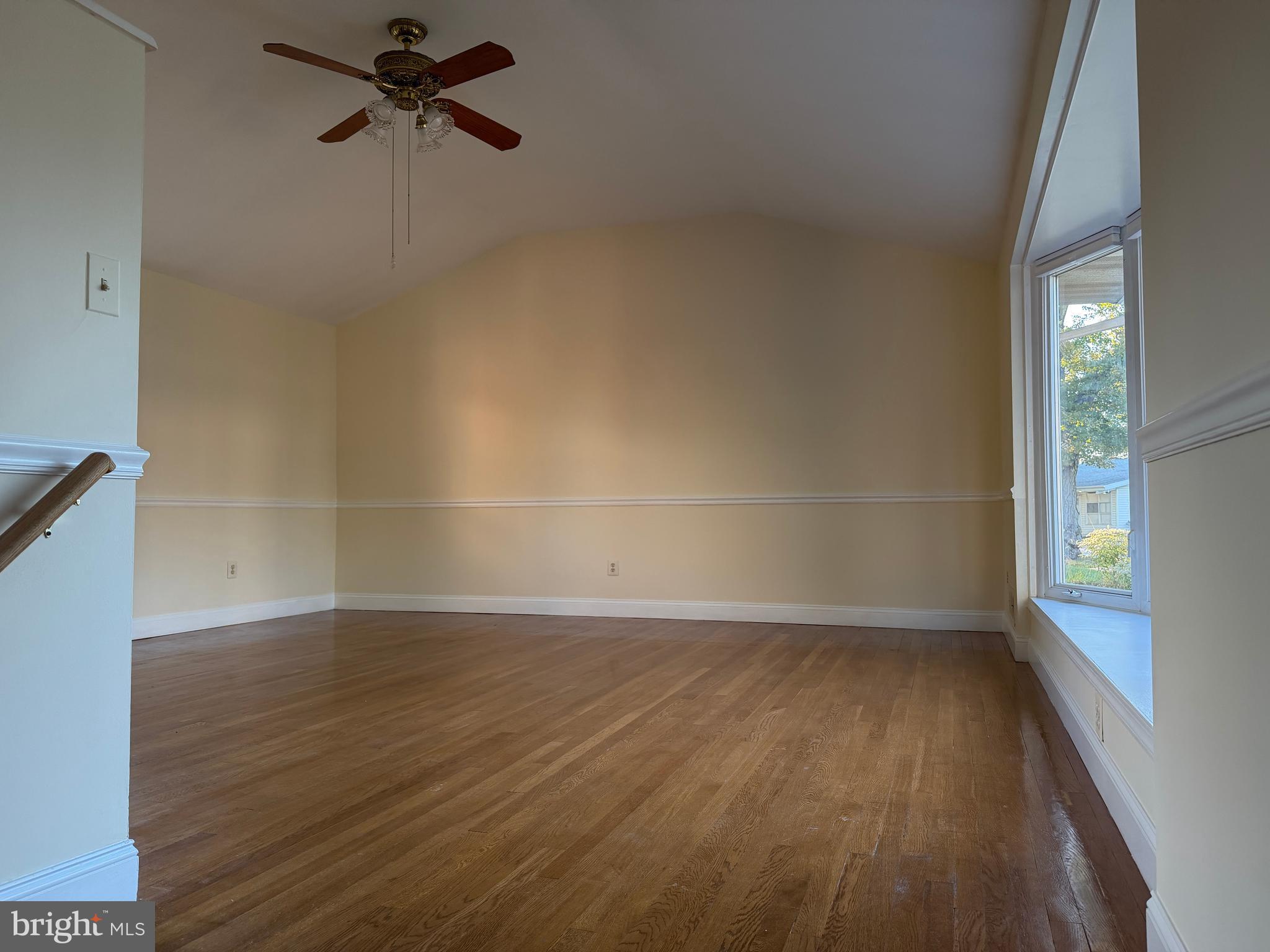 6820 Cherokee Drive Baltimore, MD 21209 - Photo 17 of 25 wooden floor in an empty room with a window
