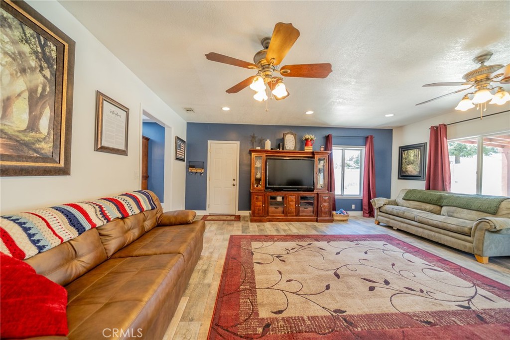 13042 Larrera Street Rancho Cucamonga, CA 91739 - Photo 1 of 1 a living room with furniture and a flat screen tv