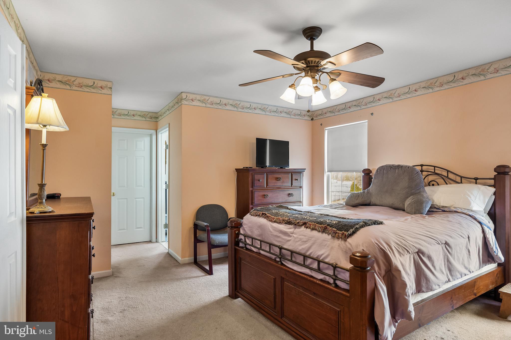 33 Colts Gait Road Marlton, NJ 08053 - Photo 25 of 41 a bedroom with a bed and a chandelier