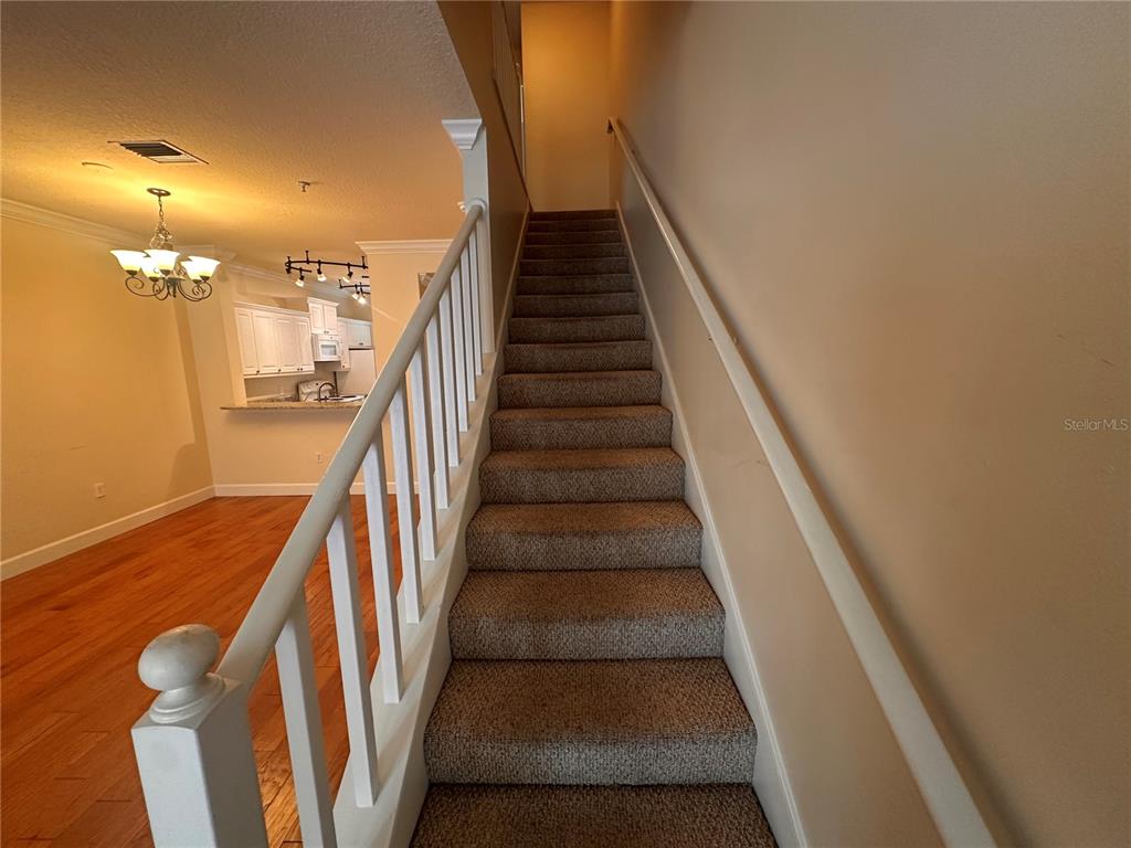 709 Bloom Street, Unit 240 Celebration, FL 34747 - Photo 5 of 17 a view of entryway and hall with wooden floor
