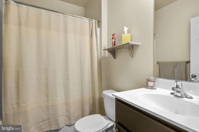 a bathroom with a sink and toilet
