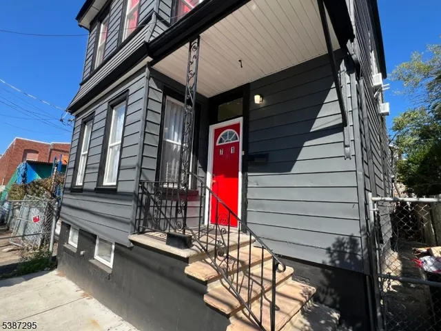 a view of a house with a flower garden