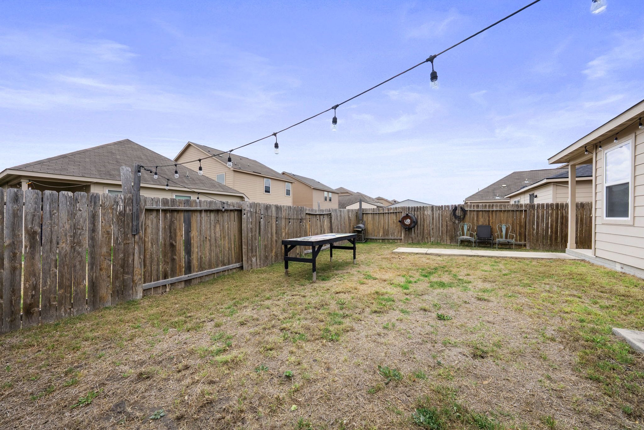1617 Treeta Trail Kyle, TX 78640 - Photo 6 of 39 Fenced backyard featuring a residential view and a patio area
