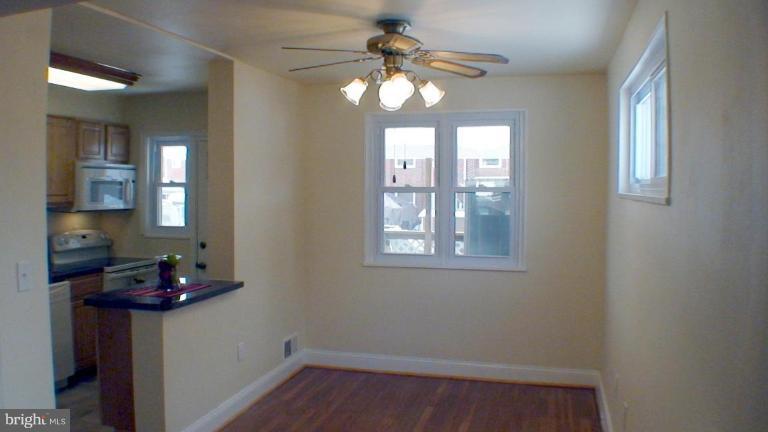1921 Jasmine Road Dundalk, MD 21222 - Photo 3 of 9 a room that has a window and a chandelier