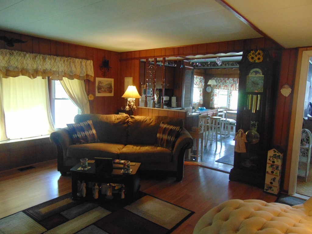 3132 Cranberry Highway, Unit 56 Wareham, MA 02538 - Photo 12 of 20 a living room with furniture and a large window