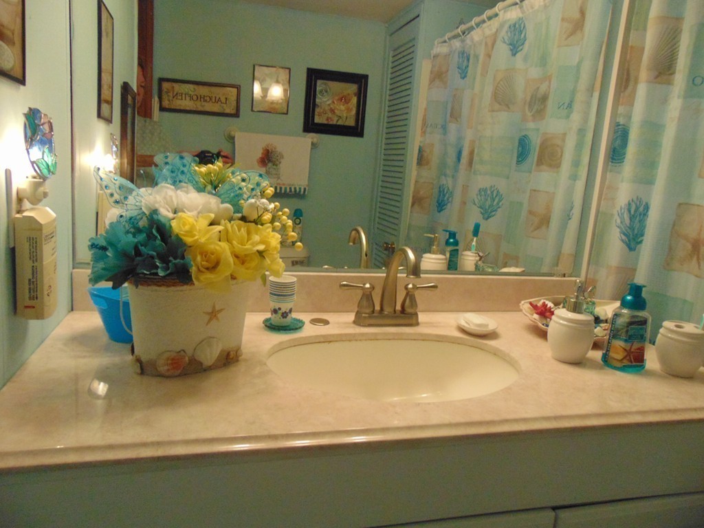 3132 Cranberry Highway, Unit 56 Wareham, MA 02538 - Photo 18 of 20 a bathroom with a sink a mirror and a shower