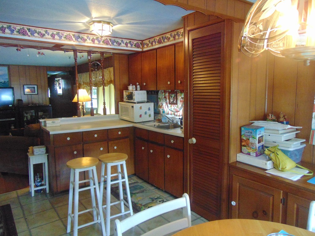 3132 Cranberry Highway, Unit 56 Wareham, MA 02538 - Photo 9 of 20 a bathroom with a sink a mirror and a shower