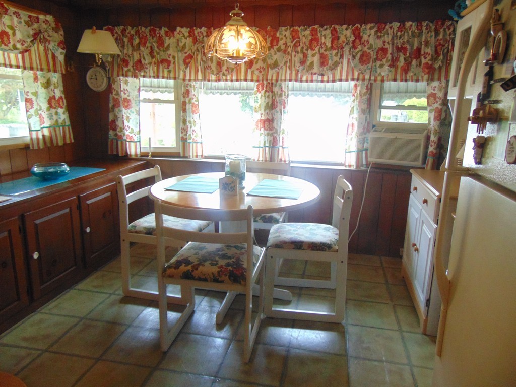 3132 Cranberry Highway, Unit 56 Wareham, MA 02538 - Photo 10 of 20 a dining room with furniture and window
