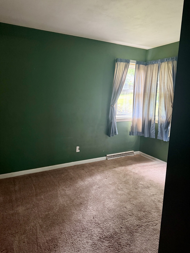 303 West Plumb Street Ransom, IL 60470 - Photo 11 of 12 an empty room with windows