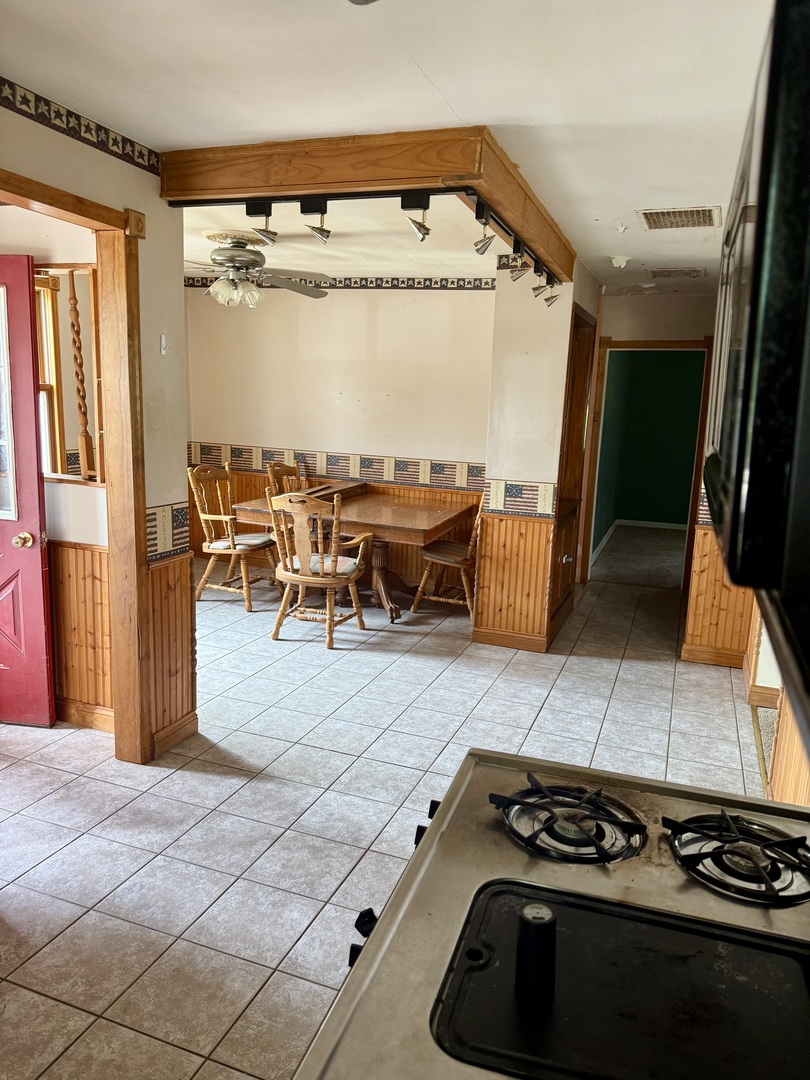303 West Plumb Street Ransom, IL 60470 - Photo 5 of 12 a kitchen with a stove and cabinets