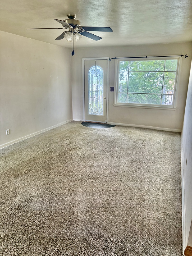 303 West Plumb Street Ransom, IL 60470 - Photo 8 of 12 a view of an empty room with a window