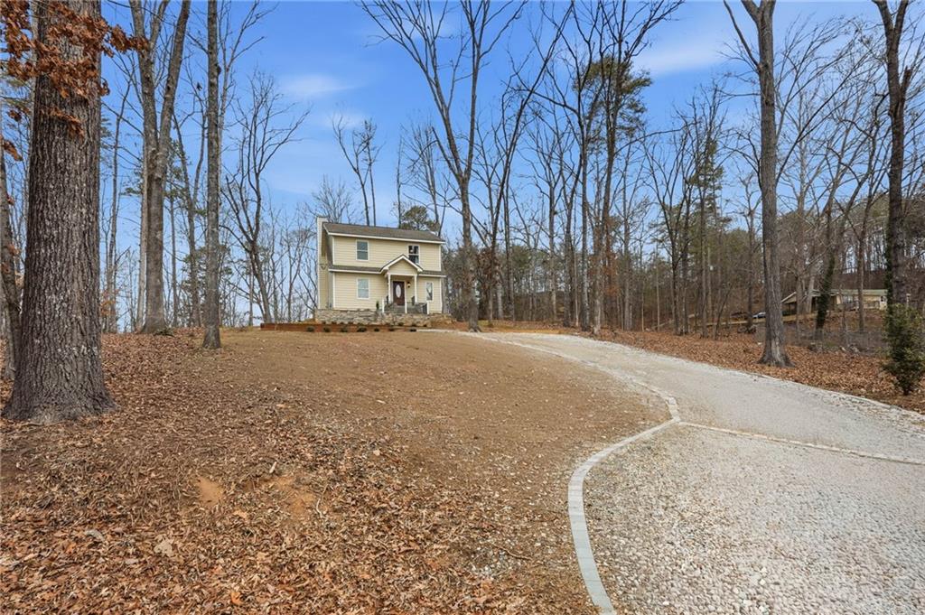 3812 James Ed Road Gainesville, GA 30506 - Photo 1 of 27 a street view with large trees