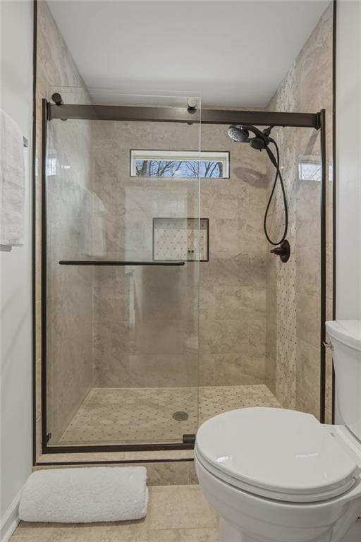 3812 James Ed Road Gainesville, GA 30506 - Photo 17 of 27 a bathroom with a toilet and a shower