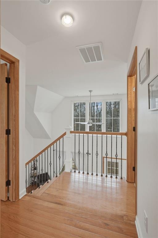 3812 James Ed Road Gainesville, GA 30506 - Photo 18 of 27 a view of a hallway with wooden floor and windows