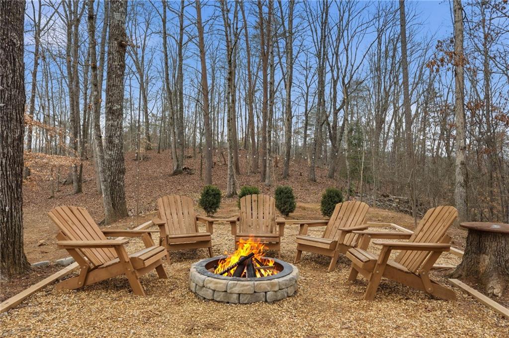 3812 James Ed Road Gainesville, GA 30506 - Photo 19 of 27 a outdoor living space with furniture and a fireplace
