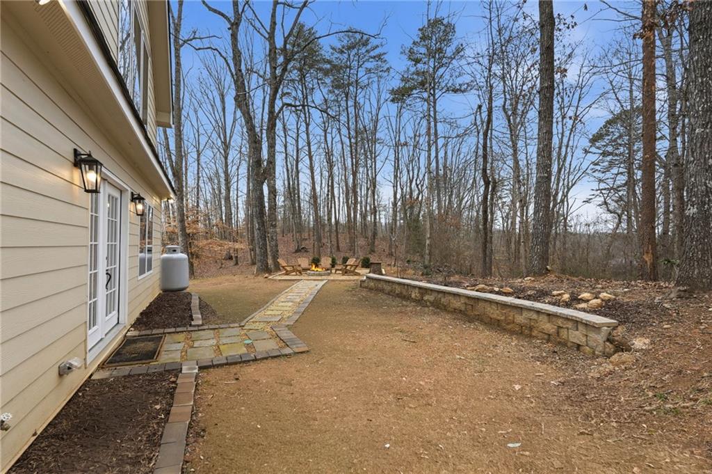 3812 James Ed Road Gainesville, GA 30506 - Photo 20 of 27 a view of a backyard with tub and trees