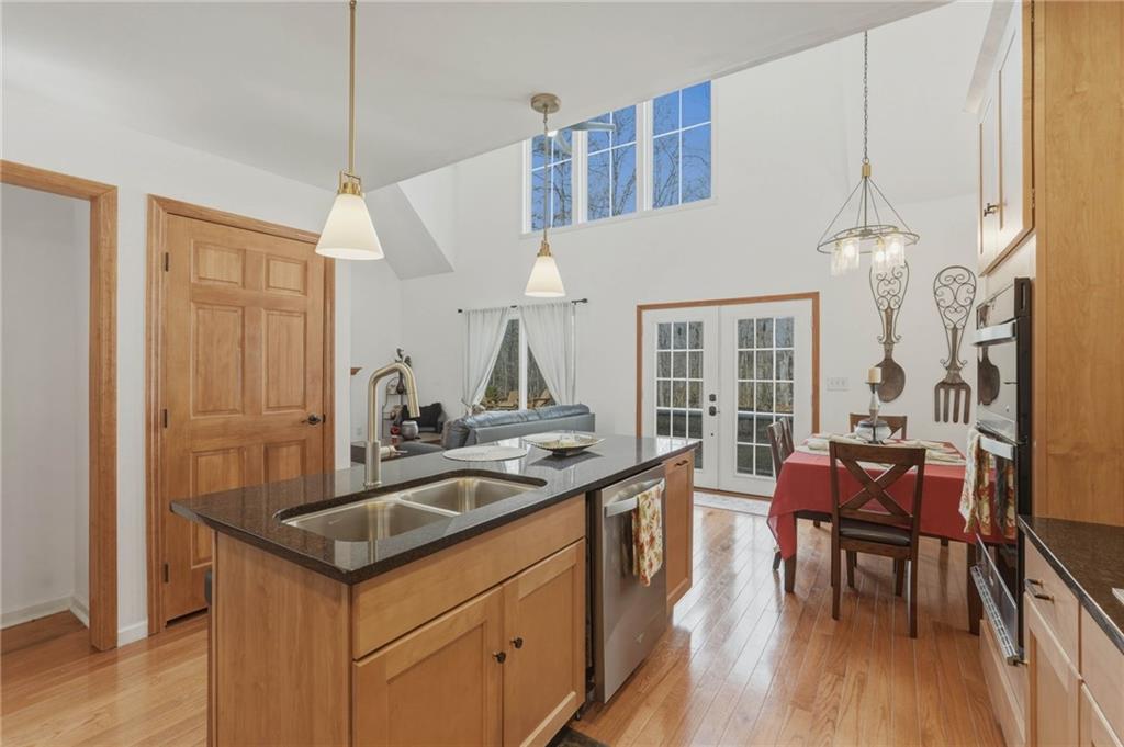 3812 James Ed Road Gainesville, GA 30506 - Photo 2 of 27 a kitchen with a sink cabinets and wooden floor