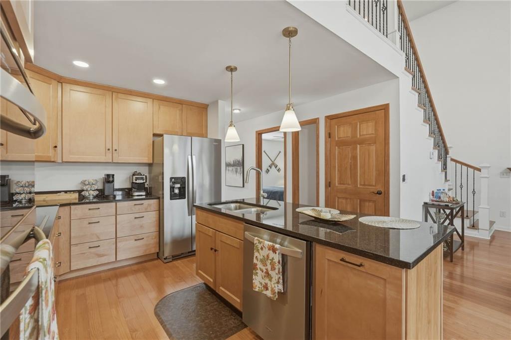 3812 James Ed Road Gainesville, GA 30506 - Photo 5 of 27 a kitchen with stainless steel appliances granite countertop a sink a stove and a refrigerator