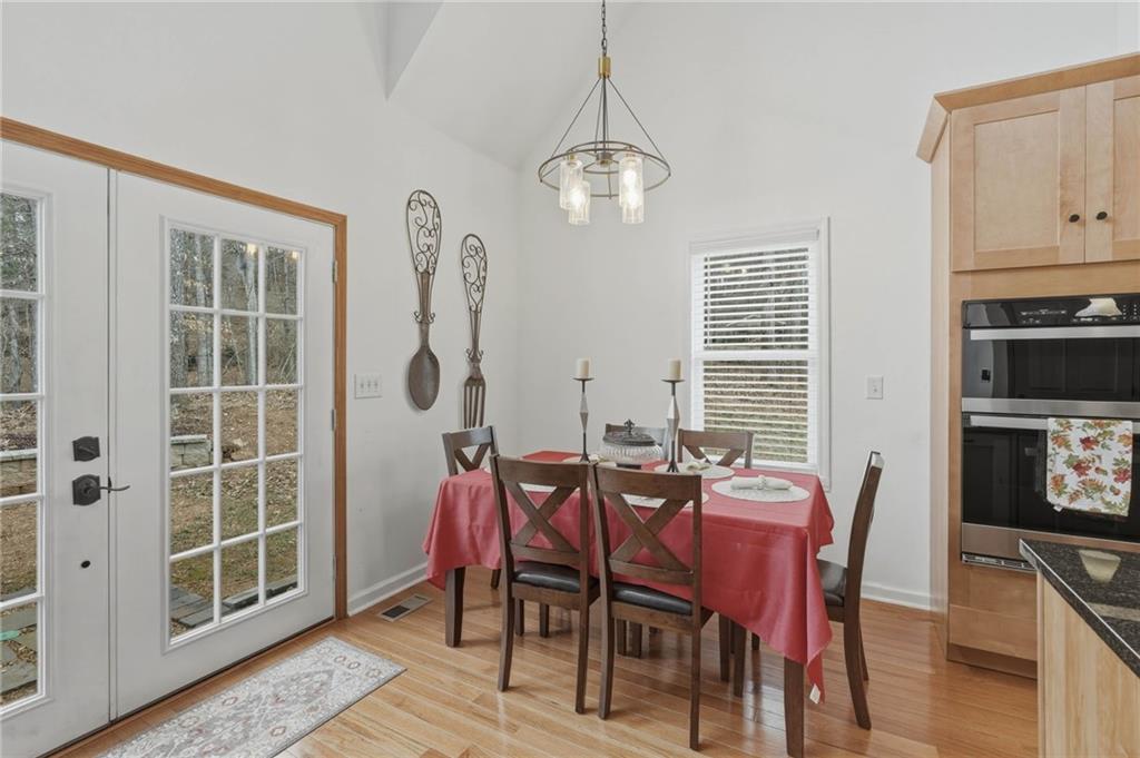 3812 James Ed Road Gainesville, GA 30506 - Photo 6 of 27 a view of a dining room with furniture and chandelier