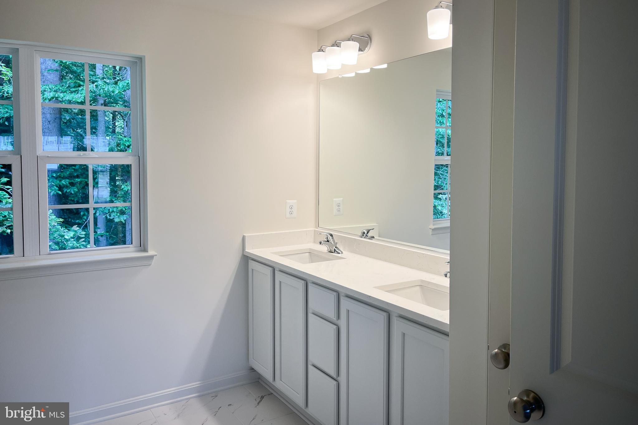 1326 Heaps Road Whiteford, MD 21160 - Photo 13 of 19 a bathroom with a sink and a mirror