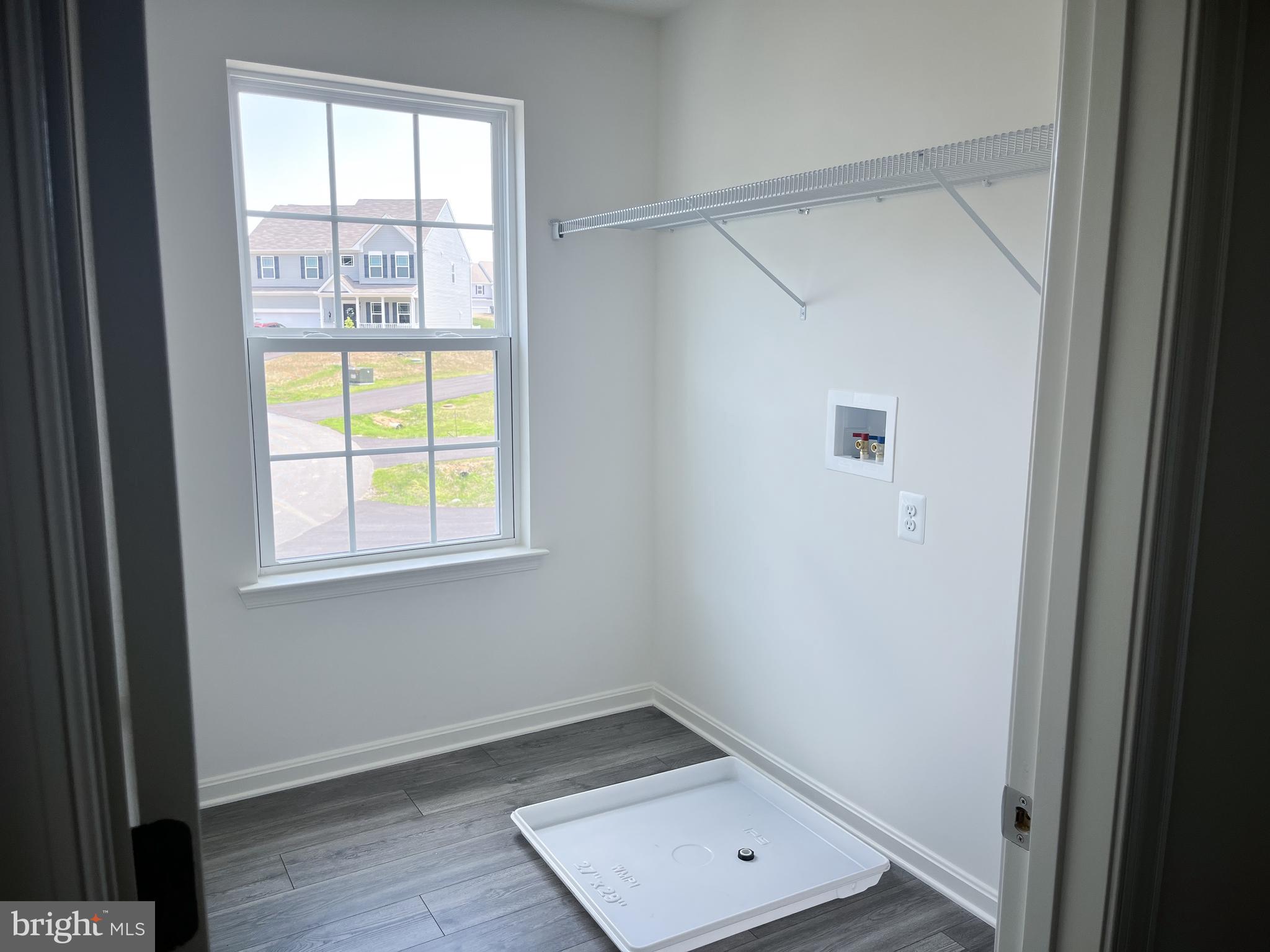 1326 Heaps Road Whiteford, MD 21160 - Photo 17 of 19 a view of an empty room with wooden floor and a window