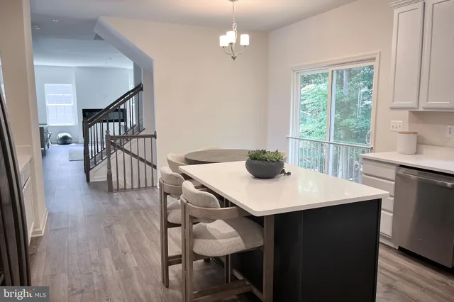 a kitchen with a sink appliances and cabinets