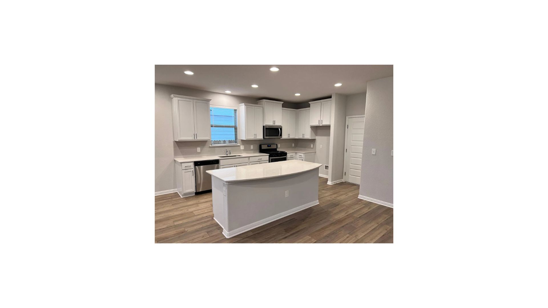 320 Rend Drive Leander, TX 78641 - Photo 3 of 11 a kitchen with a sink and cabinets