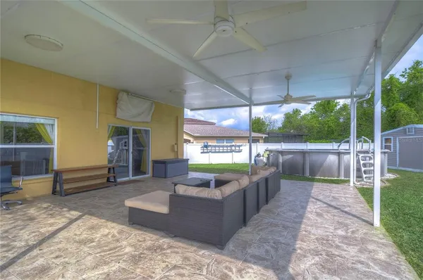 a view of a swimming pool with sitting area